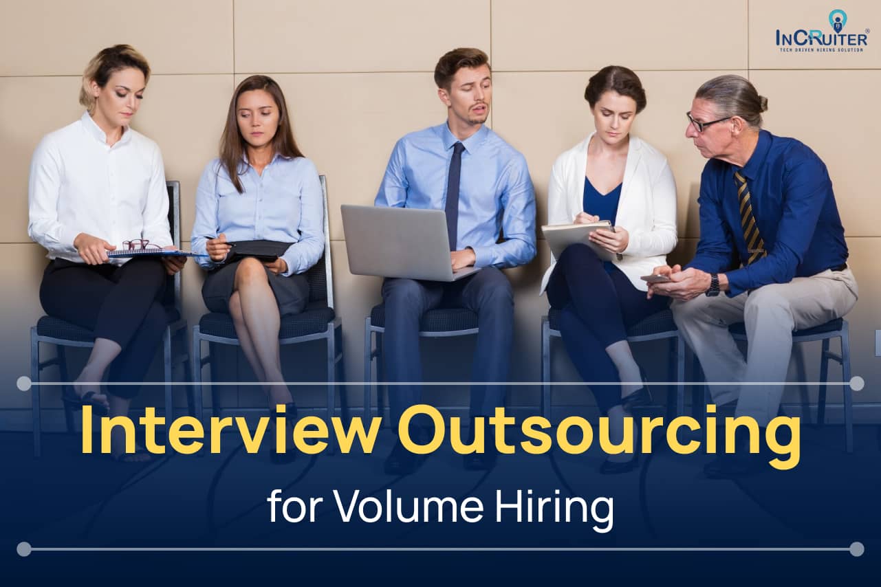 Image showing a panel of interviewers reviewing candidates, representing outsourced interviews to streamline volume hiring processes effectively.